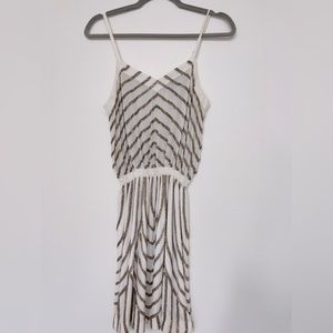 White short dress with metallic beading.